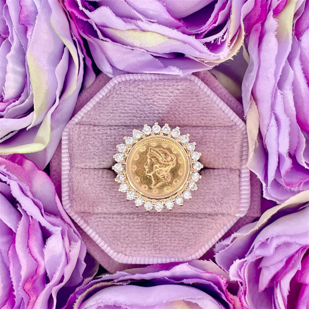 Estate- 14k yellow gold coin ring with natural diamond halo.